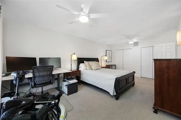 a view of entryway with paintings on the wall