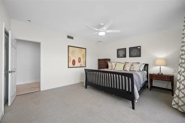 a bathroom with a granite countertop sink mirror and toilet