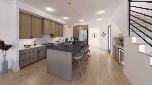 a kitchen with a sink appliances and cabinets