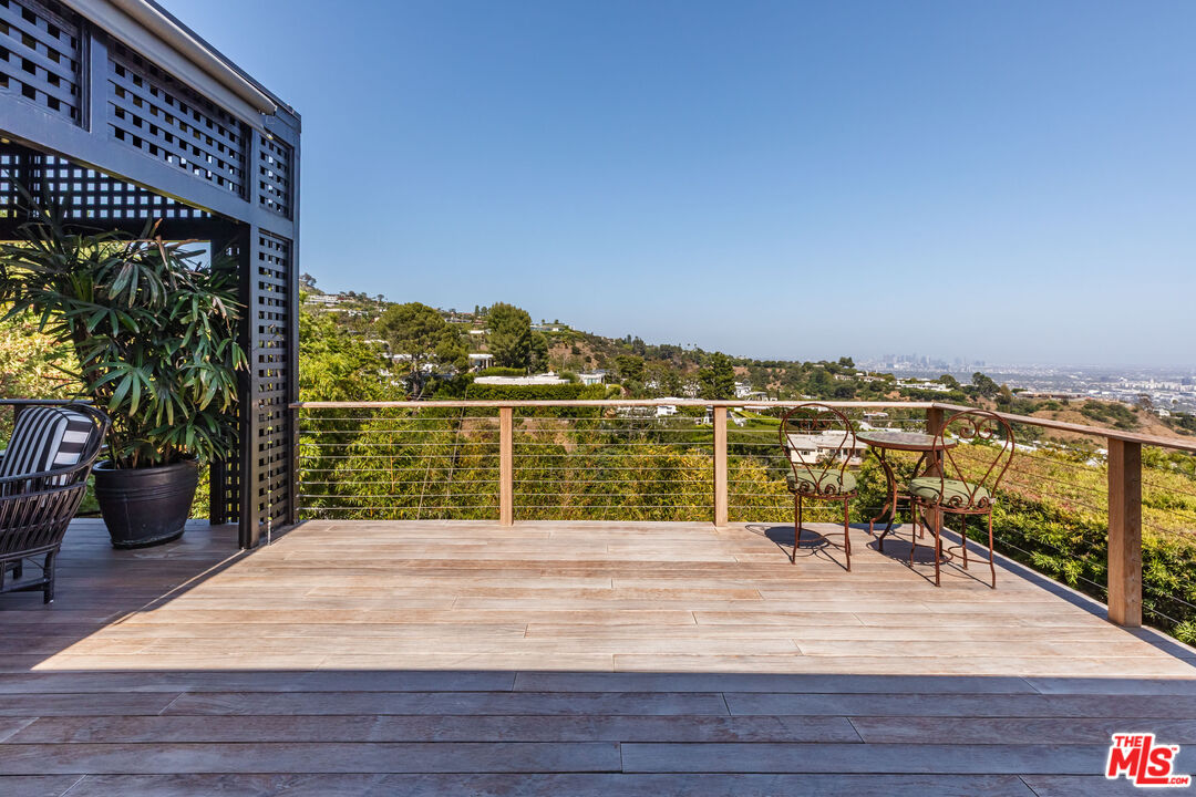 1612 Gilcrest Drive Beverly Hills, CA 90210 - Photo 13 of 33 a view of balcony with wooden floor and seating space