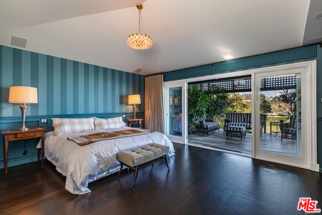 1612 Gilcrest Drive Beverly Hills, CA 90210 - Photo 17 of 33 a bed room with a bed and a lamp