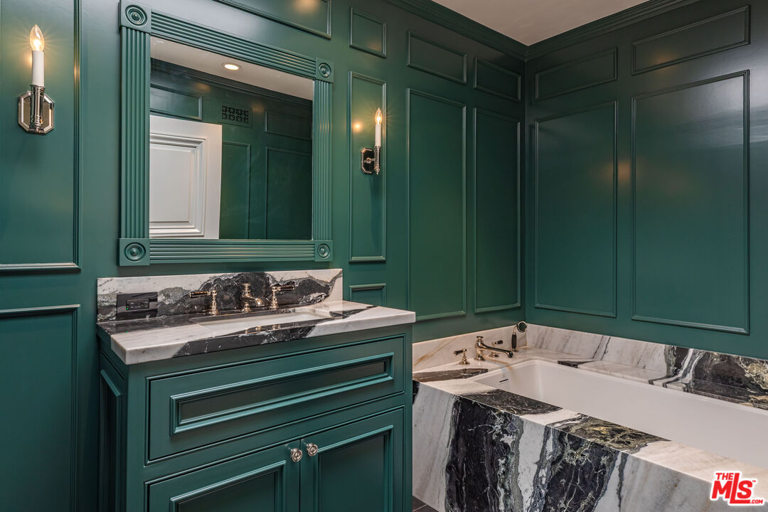 1612 Gilcrest Drive Beverly Hills, CA 90210 - Photo 21 of 33 a bathroom with a sink and a mirror