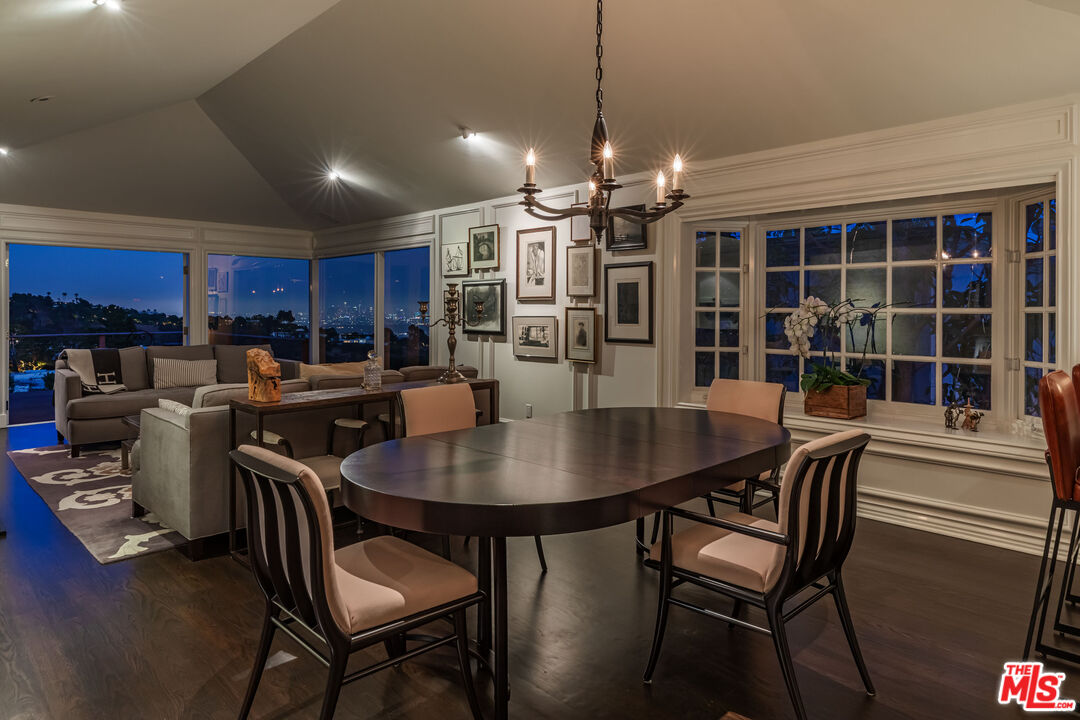 1612 Gilcrest Drive Beverly Hills, CA 90210 - Photo 27 of 33 a view of a dining room with furniture window and wooden floor