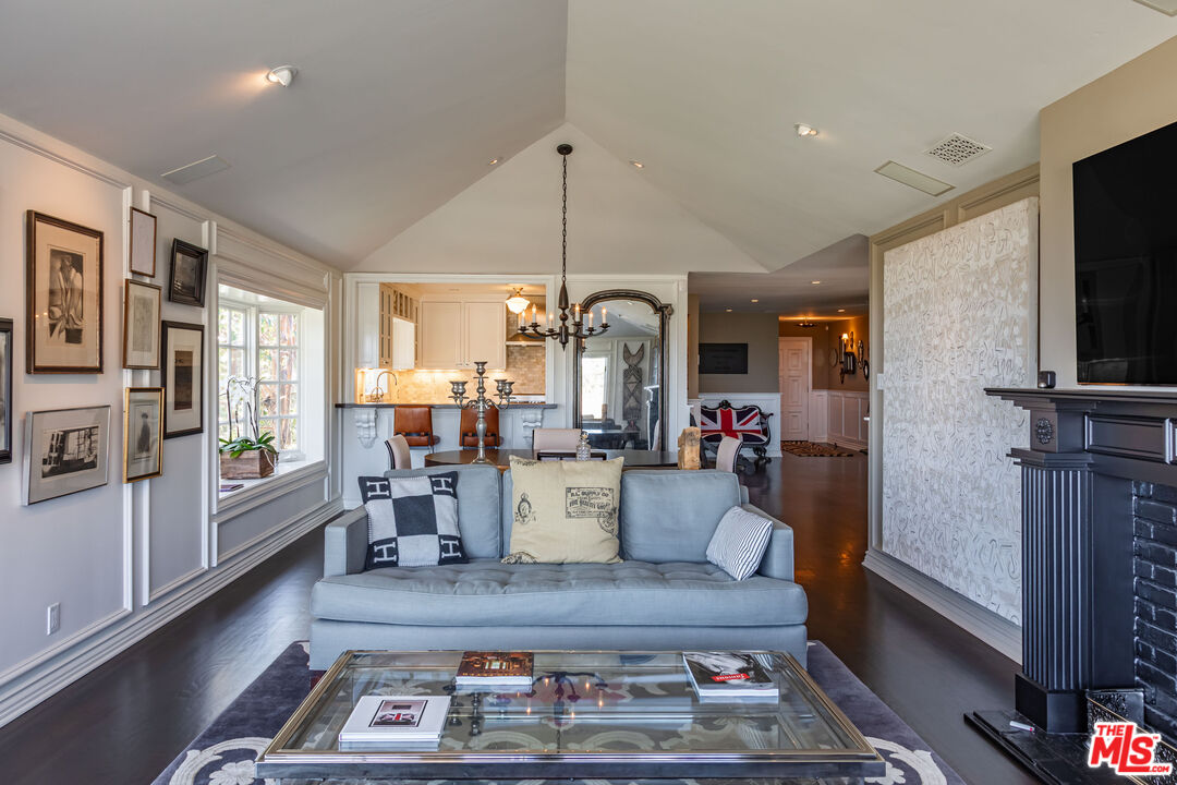 1612 Gilcrest Drive Beverly Hills, CA 90210 - Photo 6 of 33 a living room with furniture and a flat screen tv