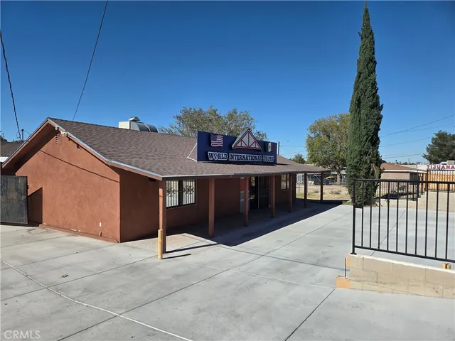 a view of roof deck with a barbeque and wooden fence