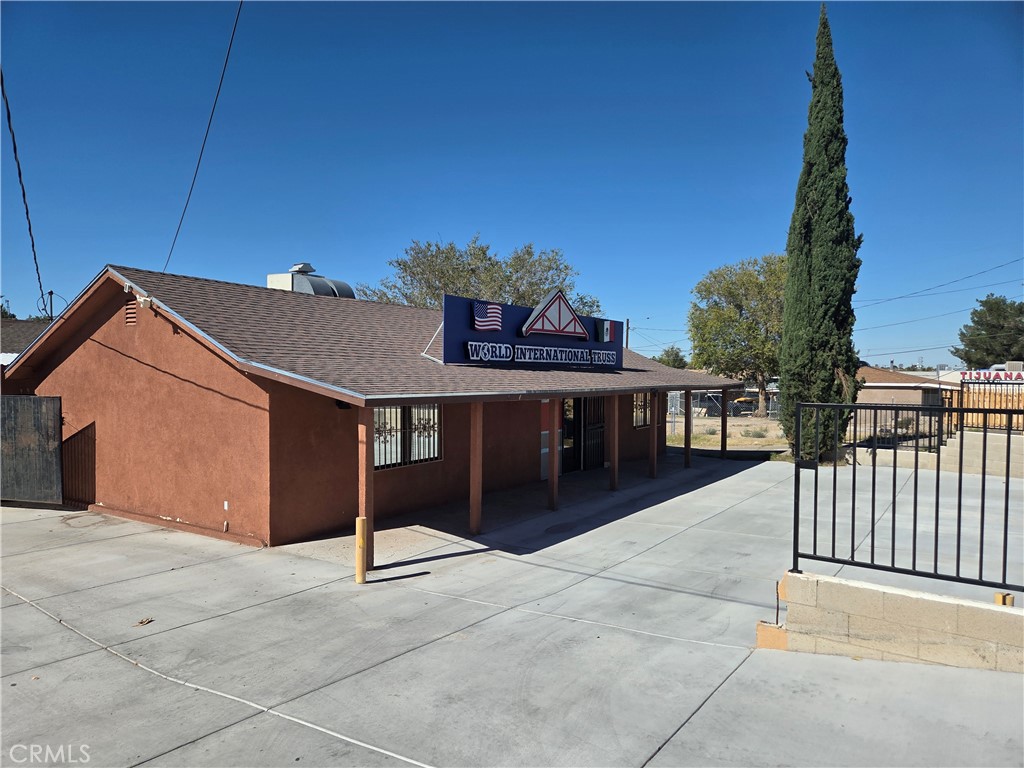 14258 Hesperia Road Victorville, CA 92395 - Photo 3 of 6 a view of a house with a outdoor space