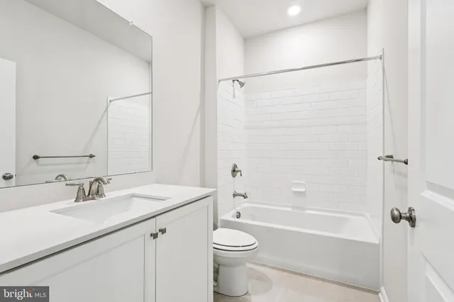 a bathroom with a granite countertop sink mirror and double