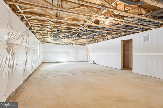 a view of a room with wooden walls