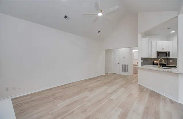 a view of kitchen with wooden floor