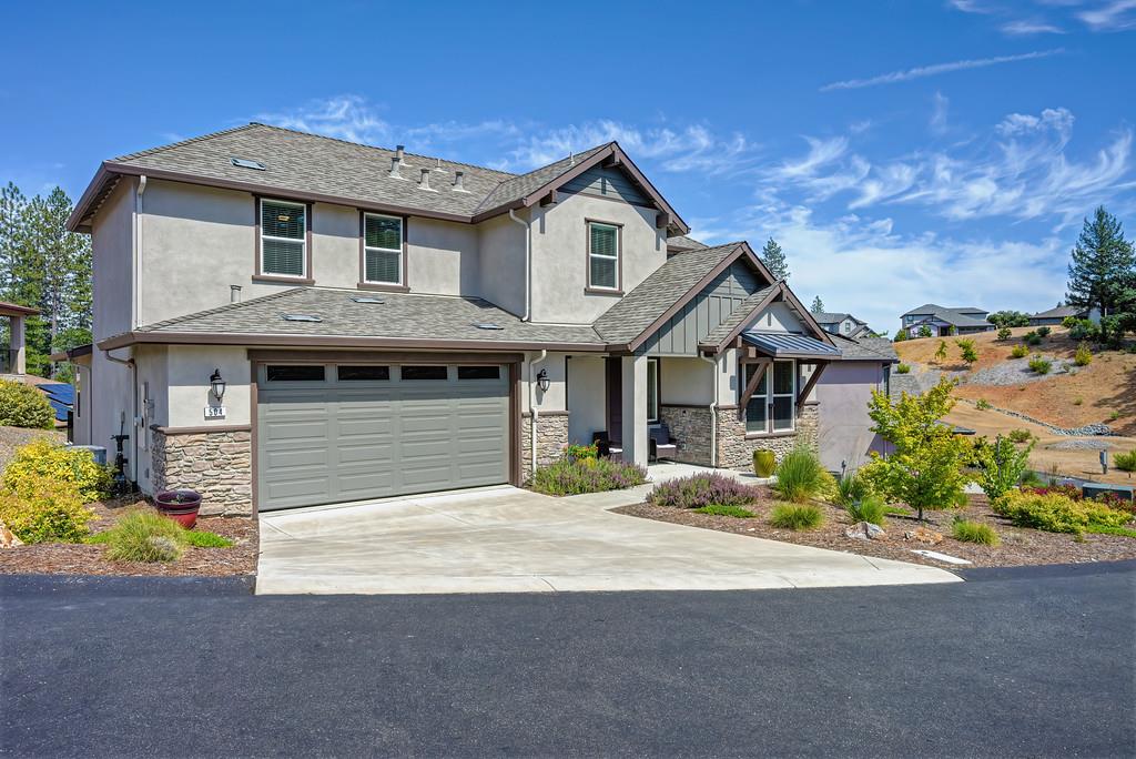 504 Chase Court Colfax, CA 95713 - Photo 17 of 94 a front view of a house with a yard and garage