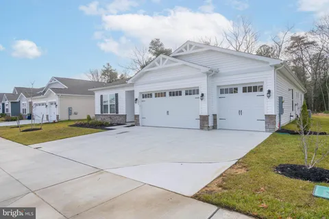 a view of a house with swimming pool and a yard
