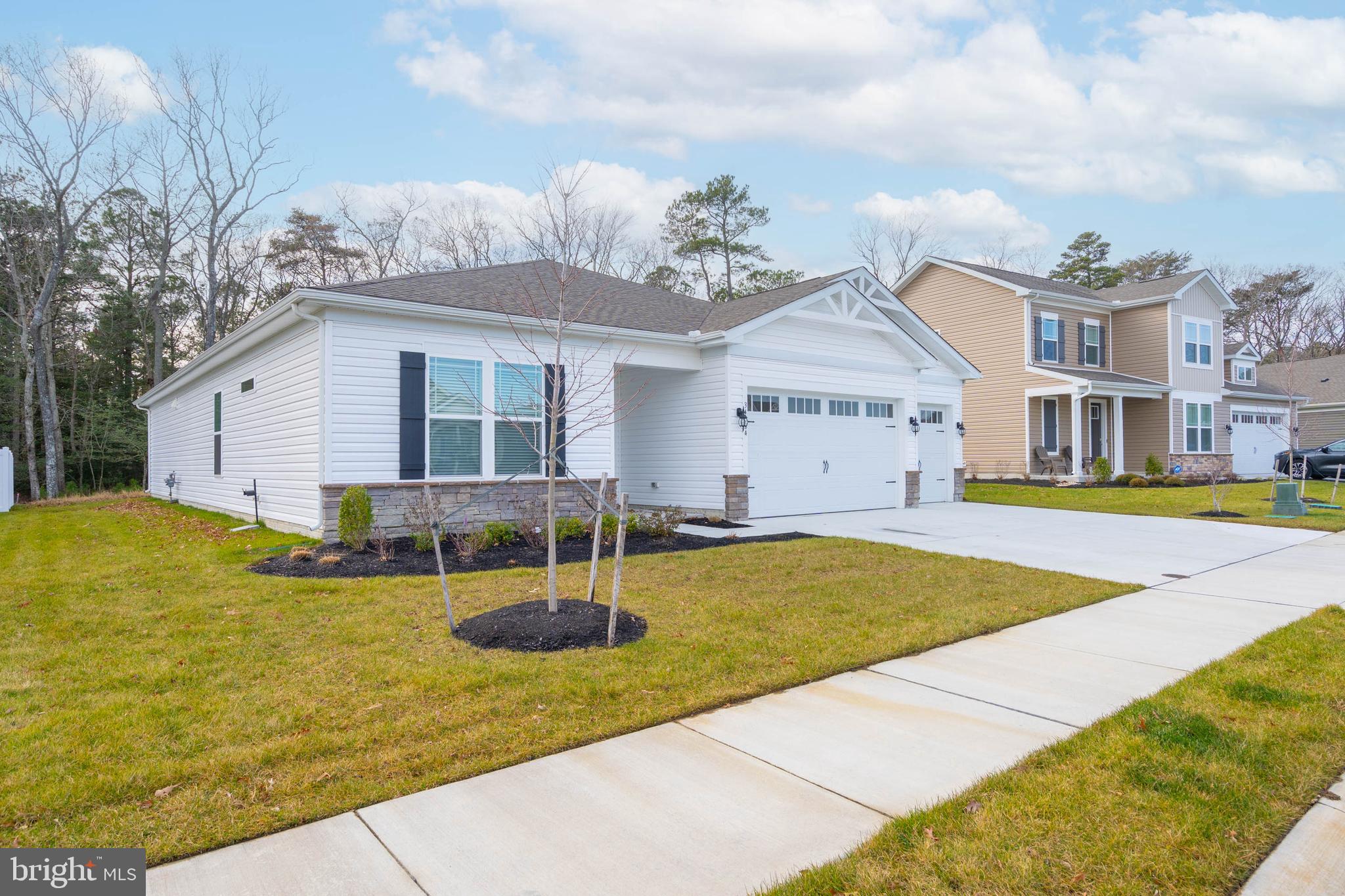 34084 Skyflower Loop Lewes, DE 19958 - Photo 13 of 50 a view of a house with swimming pool and a yard