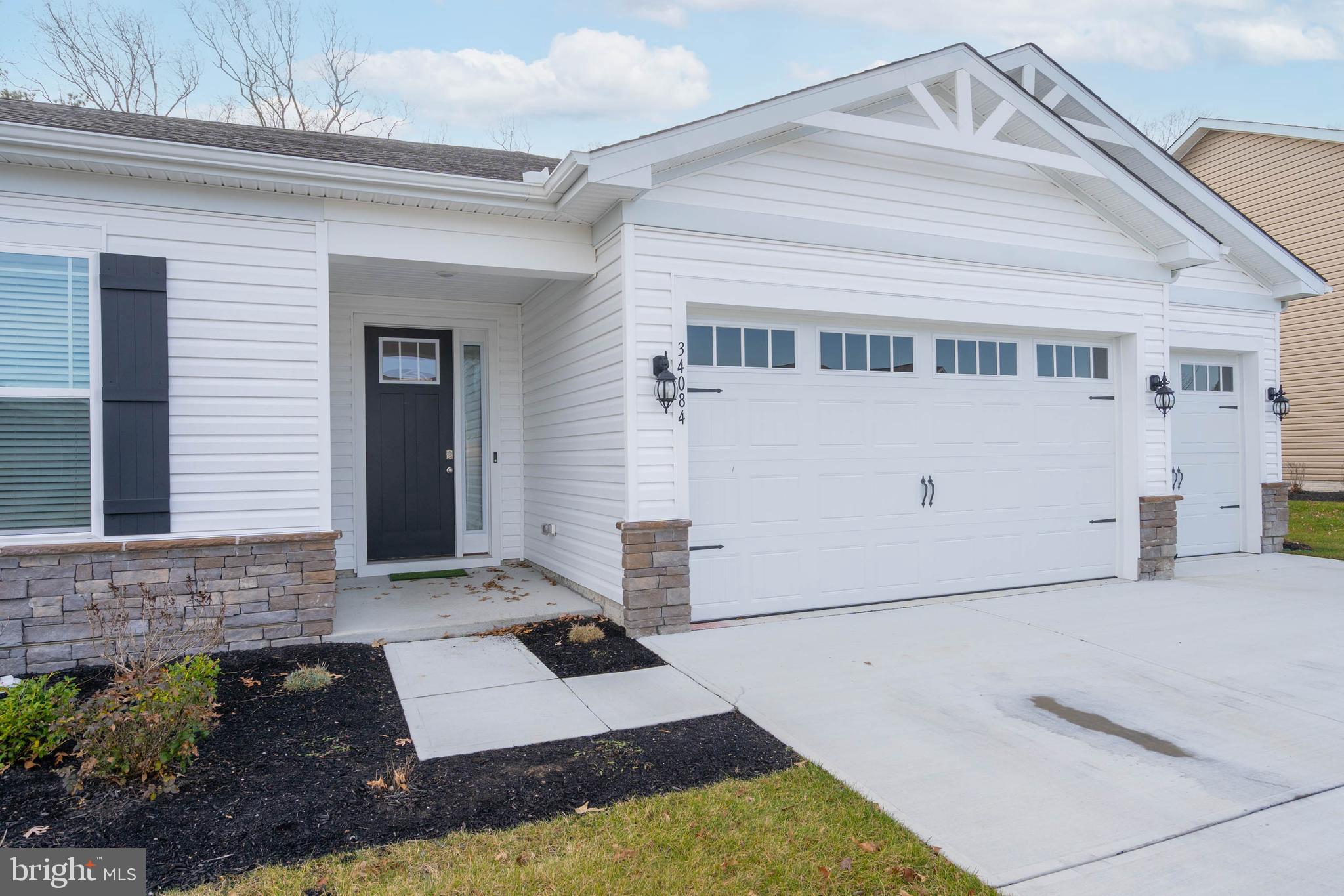 34084 Skyflower Loop Lewes, DE 19958 - Photo 14 of 50 a view of a house with a yard