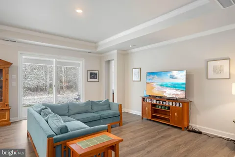 a living room with furniture and a lamp