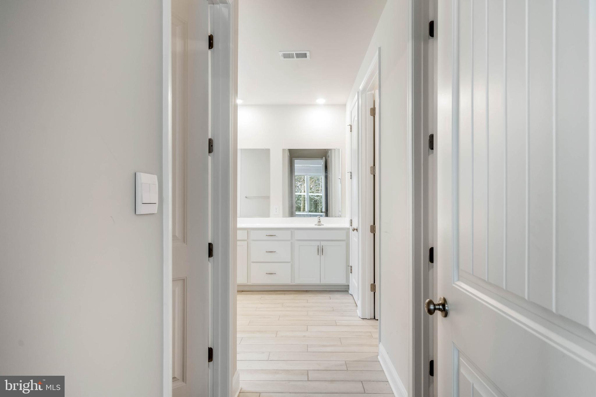 34084 Skyflower Loop Lewes, DE 19958 - Photo 38 of 50 a bathroom with a glass shower door