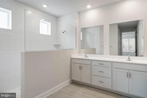 a view of walk in closet with clothes