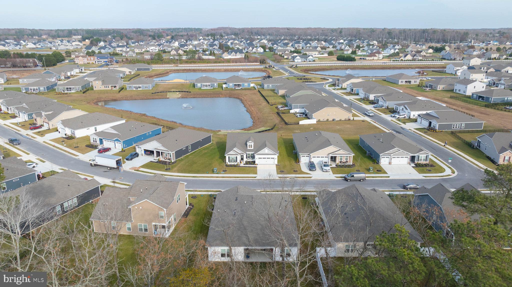 34084 Skyflower Loop Lewes, DE 19958 - Photo 4 of 50 an aerial view of residential houses with outdoor space