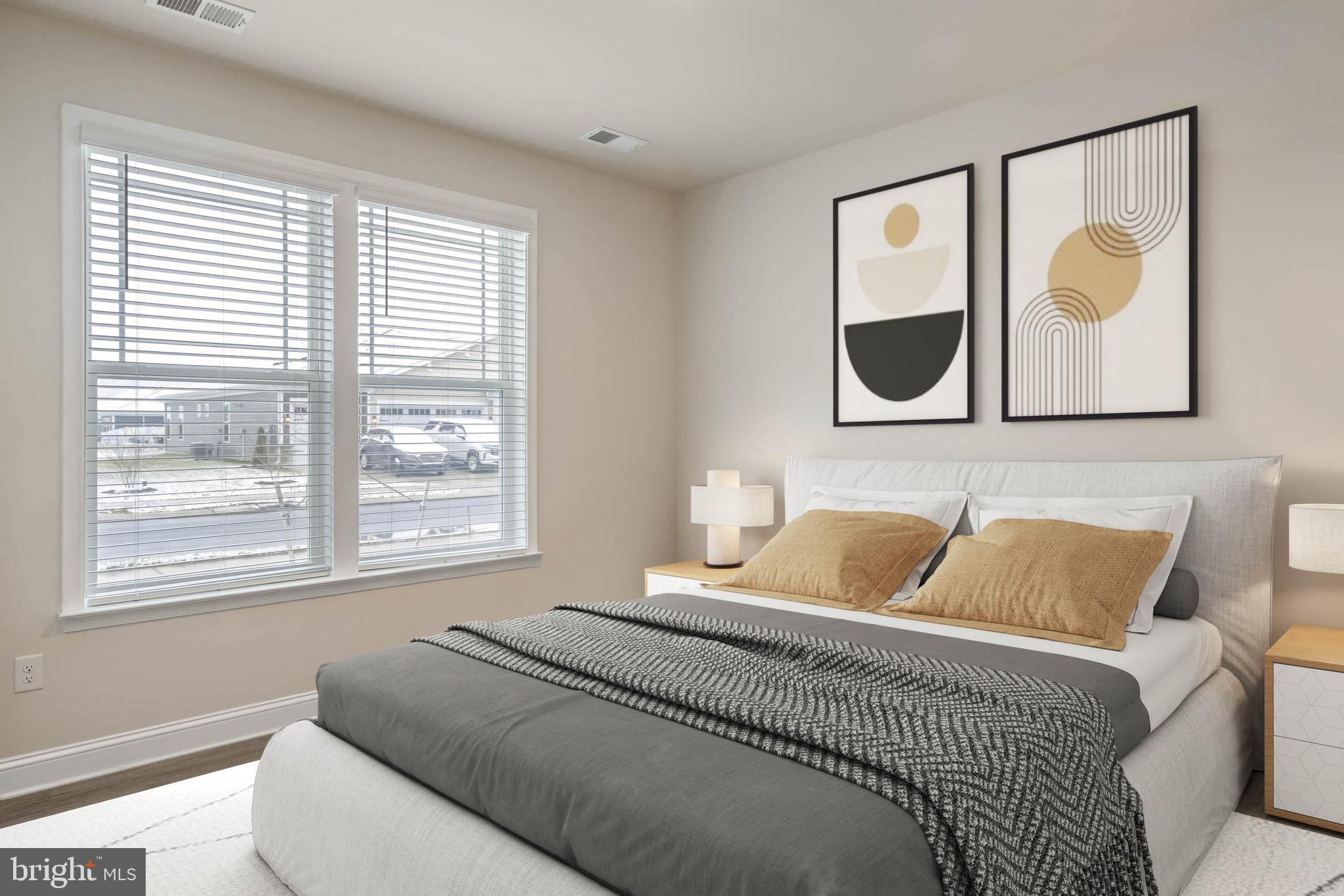 34084 Skyflower Loop Lewes, DE 19958 - Photo 42 of 50 a bedroom with a bed and painting on the wall