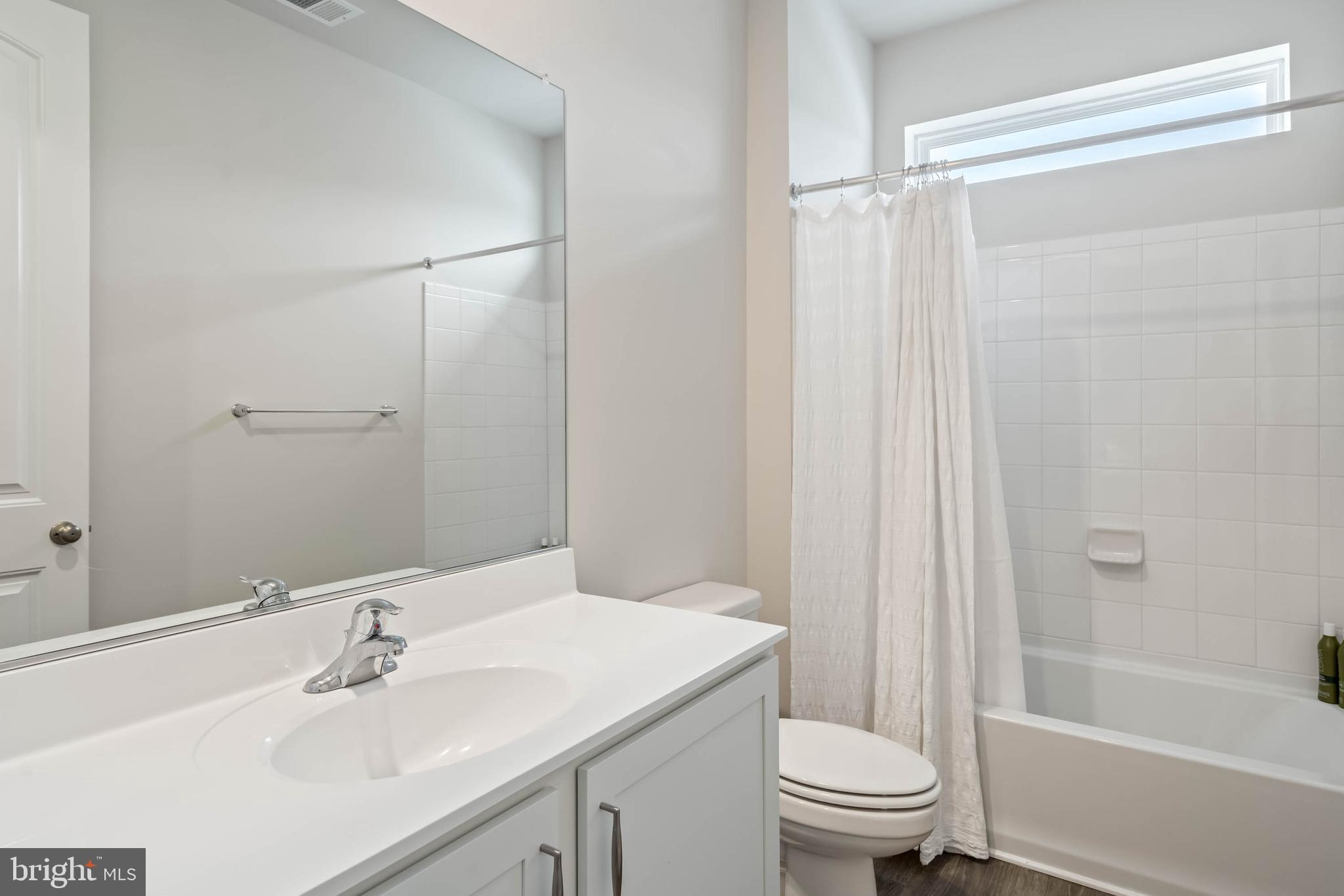 34084 Skyflower Loop Lewes, DE 19958 - Photo 43 of 50 a bathroom with a sink toilet and shower