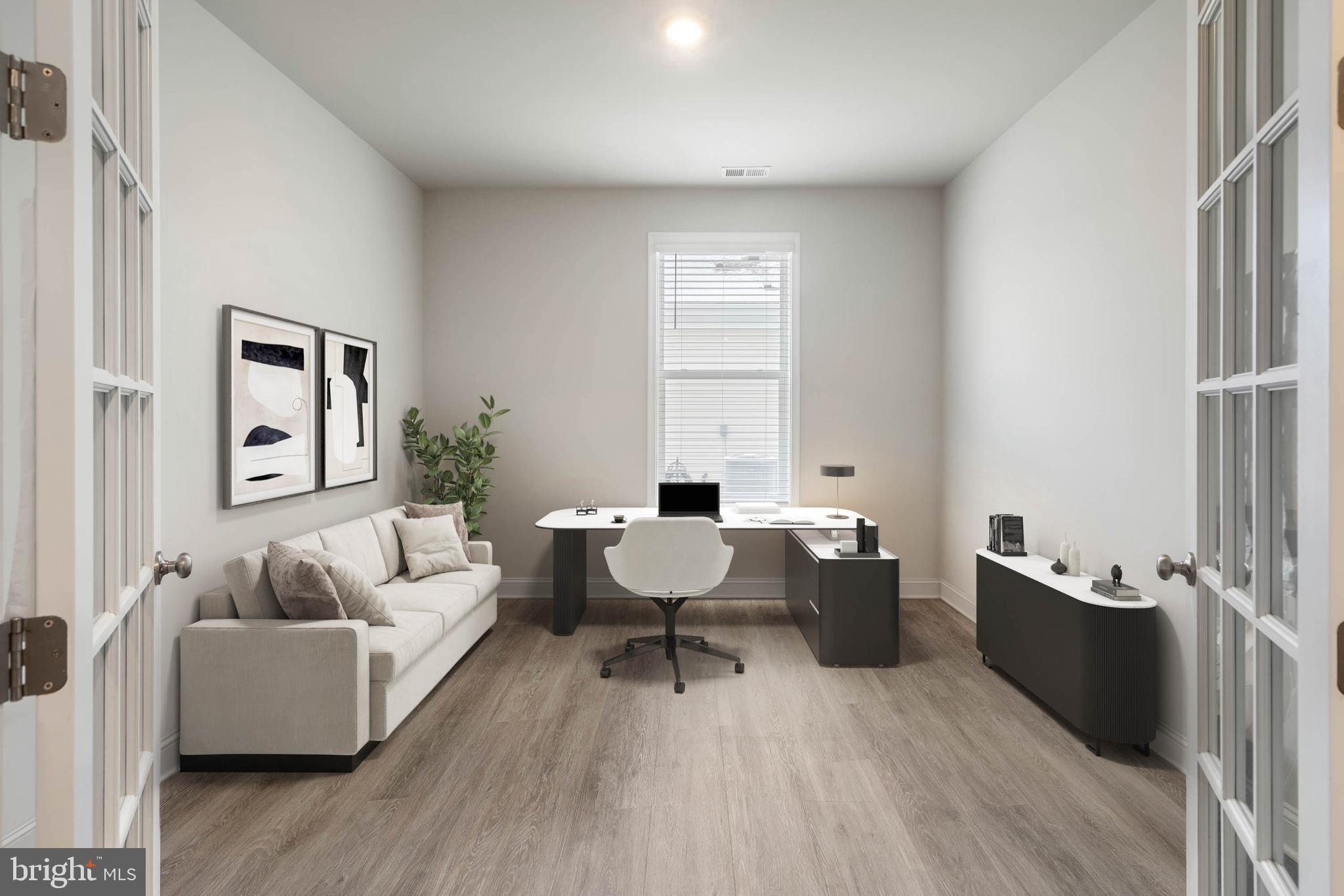 34084 Skyflower Loop Lewes, DE 19958 - Photo 44 of 50 a living room with furniture and wooden floor