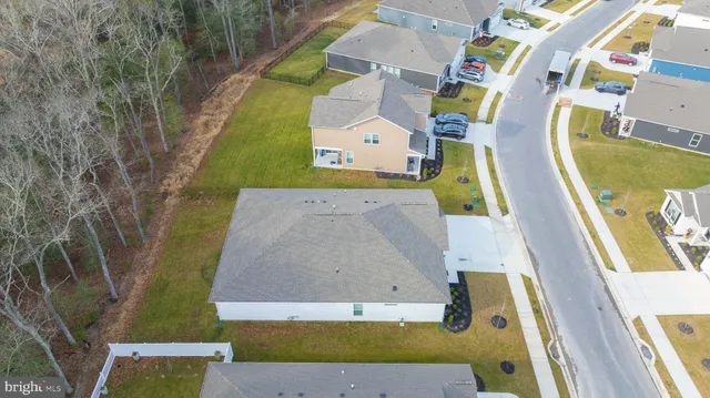 an aerial view of residential house with pool
