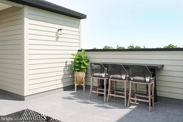 a view of a patio with table and chairs and potted plants