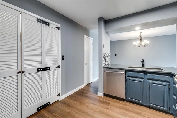 a view of a kitchen from the hallway