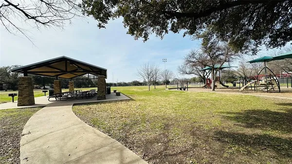 a view of grassy field with trees