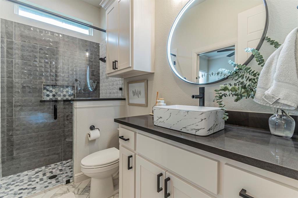 150 Las Brisas Drive Decatur, TX 76234 - Photo 21 of 32 Full bathroom featuring vanity, a stall shower, and a textured wall