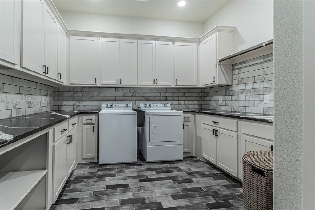 150 Las Brisas Drive Decatur, TX 76234 - Photo 24 of 32 Laundry area featuring washing machine and dryer, cabinet space, and recessed lighting