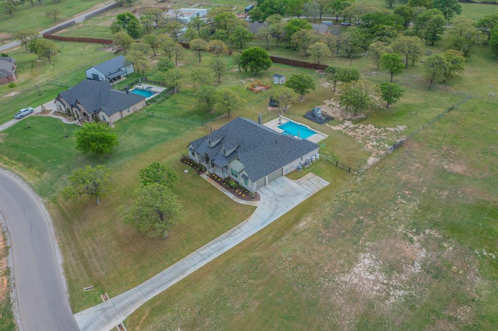 150 Las Brisas Drive Decatur, TX 76234 - Photo 27 of 32 View of subject property featuring a pool