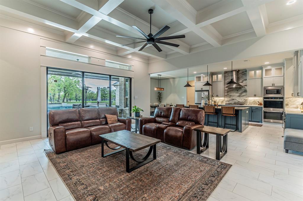 150 Las Brisas Drive Decatur, TX 76234 - Photo 6 of 32 Living area with a ceiling fan, ornamental molding, coffered ceiling, recessed lighting, and light marble finish flooring