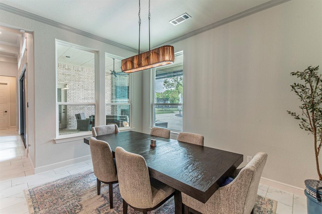 150 Las Brisas Drive Decatur, TX 76234 - Photo 9 of 32 Dining room with crown molding and a textured wall