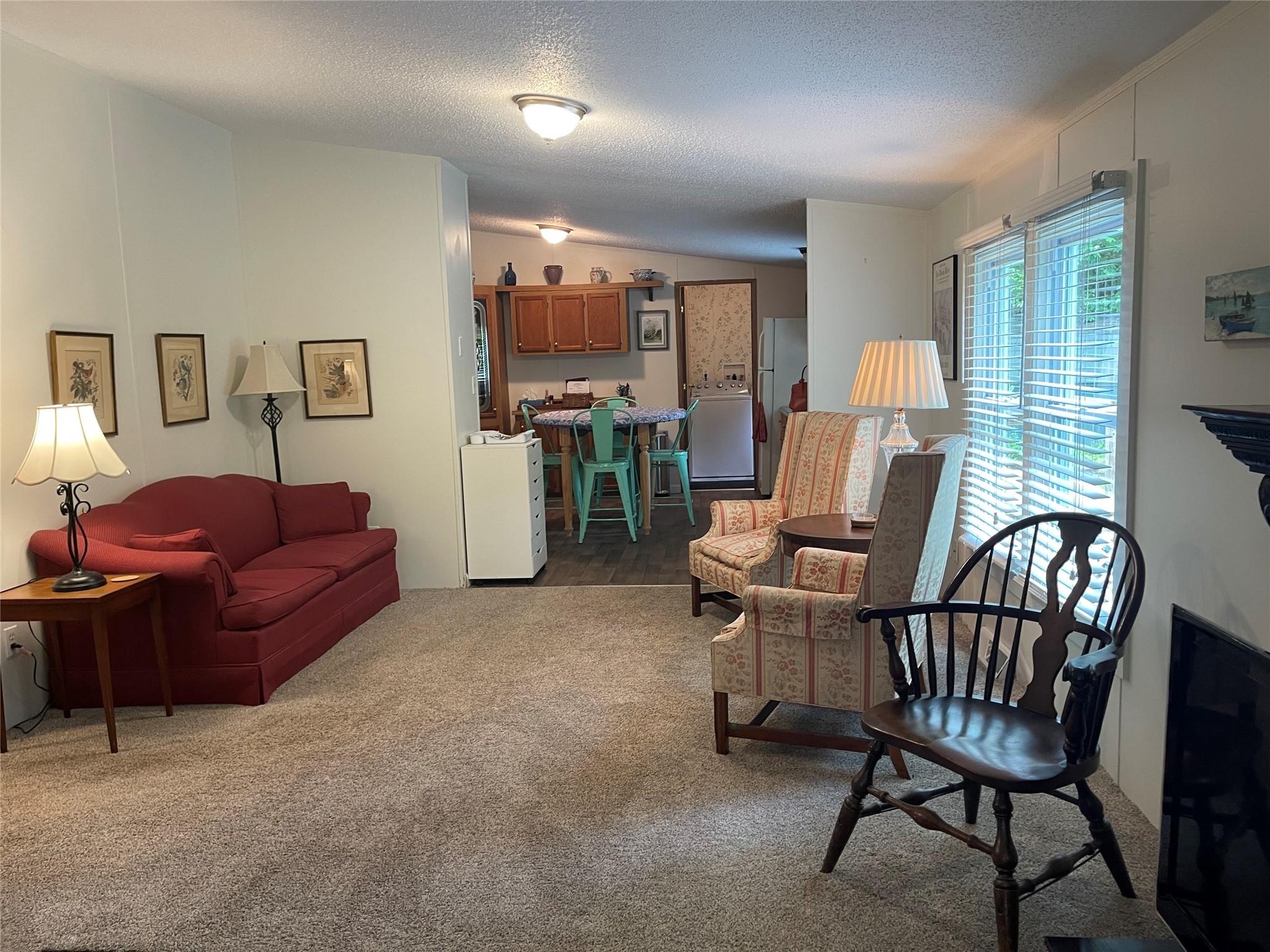 4261 State Rt 17B Callicoon, NY 12723 - Photo 10 of 37 a living room with furniture a flat screen tv and a window