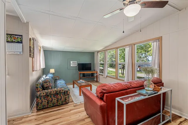 a room with furniture and a flat screen tv