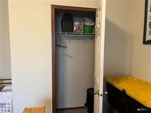 a view of a bedroom from a hallway