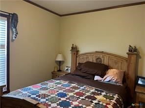 847 Hefner Lane Cuero, TX 77954 - Photo 44 of 48 a bedroom with a bed and a window