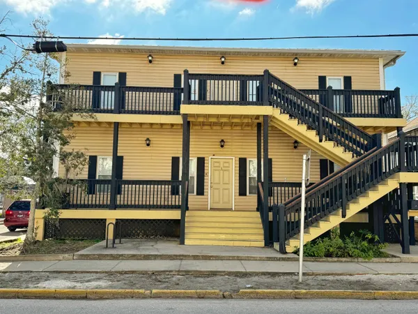 a view of a house with wooden stairs