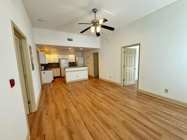 a view of a living room a sink and wooden floor