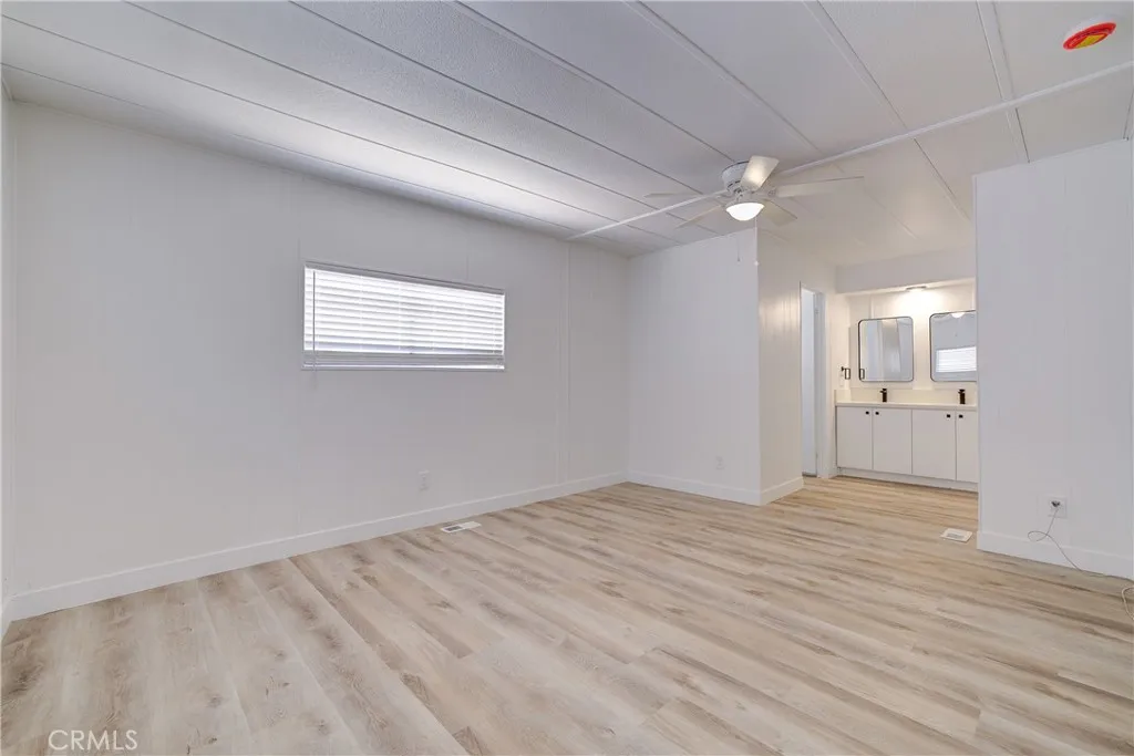 3700 Buchanan Street, Unit 164 Riverside, CA 92503 - Photo 25 of 40 wooden floor in an empty room with a window