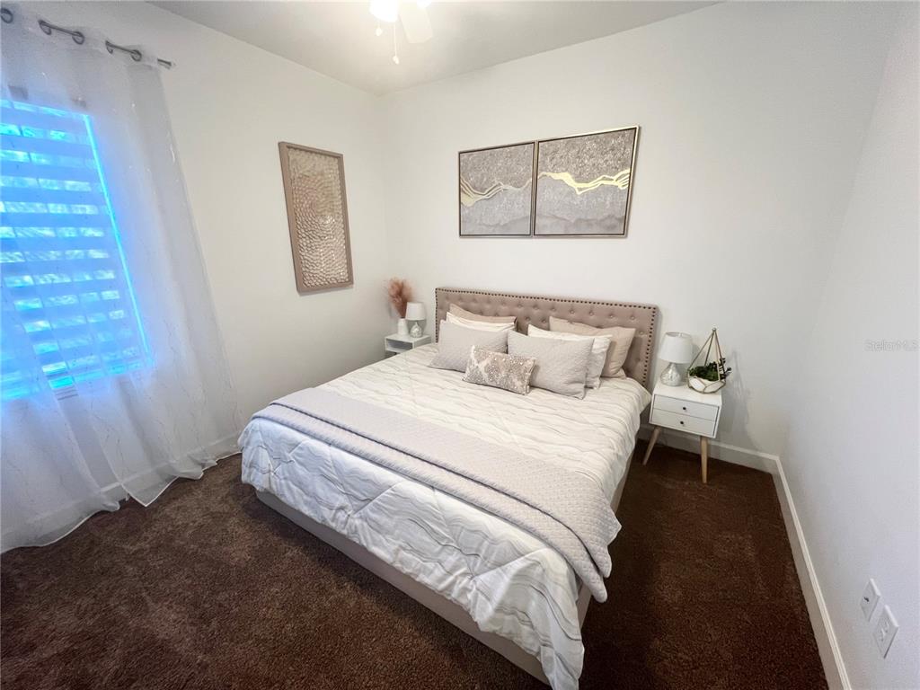 8224 Leopold Avenue North Port, FL 34287 - Photo 12 of 24 a bedroom with a bed and a window