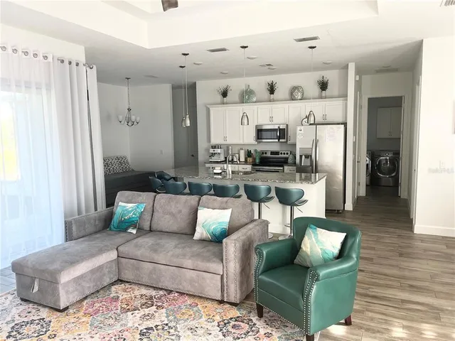 a living room with furniture and a rug