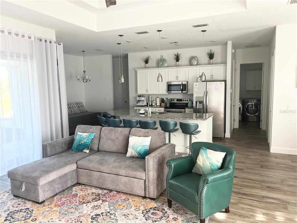 8224 Leopold Avenue North Port, FL 34287 - Photo 6 of 24 a living room with furniture and a rug