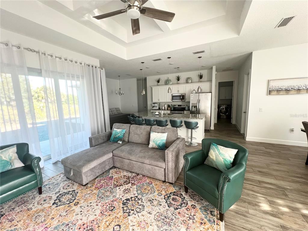 8224 Leopold Avenue North Port, FL 34287 - Photo 7 of 24 a living room with furniture and a large window