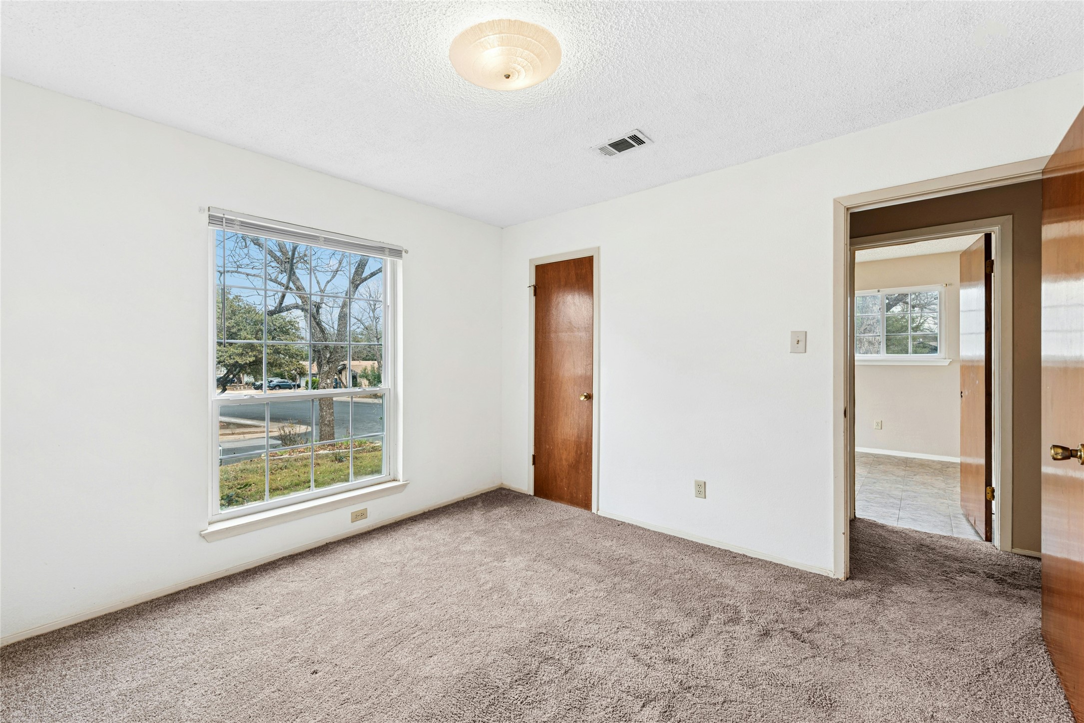 1444 Salem Meadow Circle Austin, TX 78745 - Photo 22 of 35 an empty room with windows
