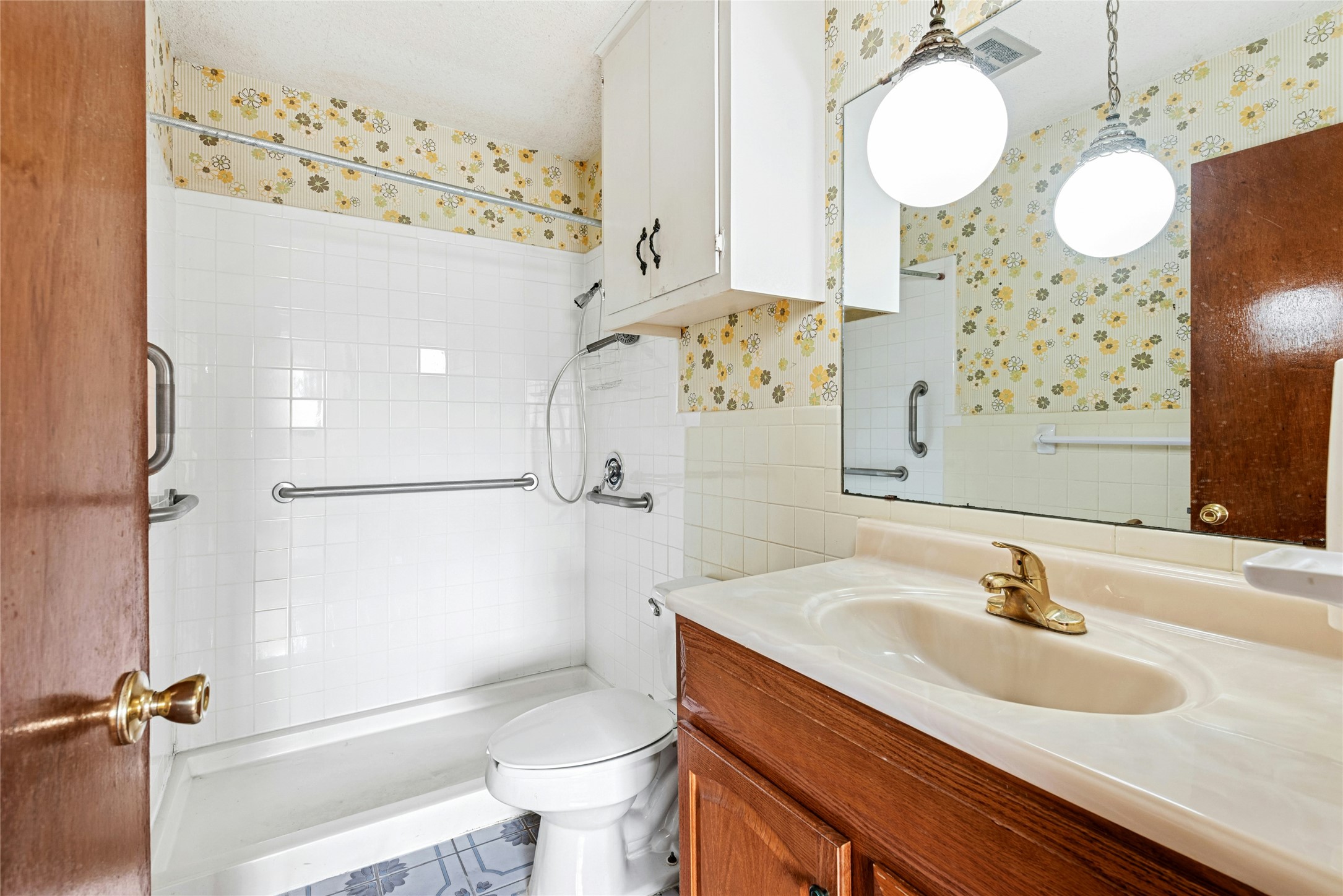 1444 Salem Meadow Circle Austin, TX 78745 - Photo 27 of 35 a bathroom with a sink a toilet and shower
