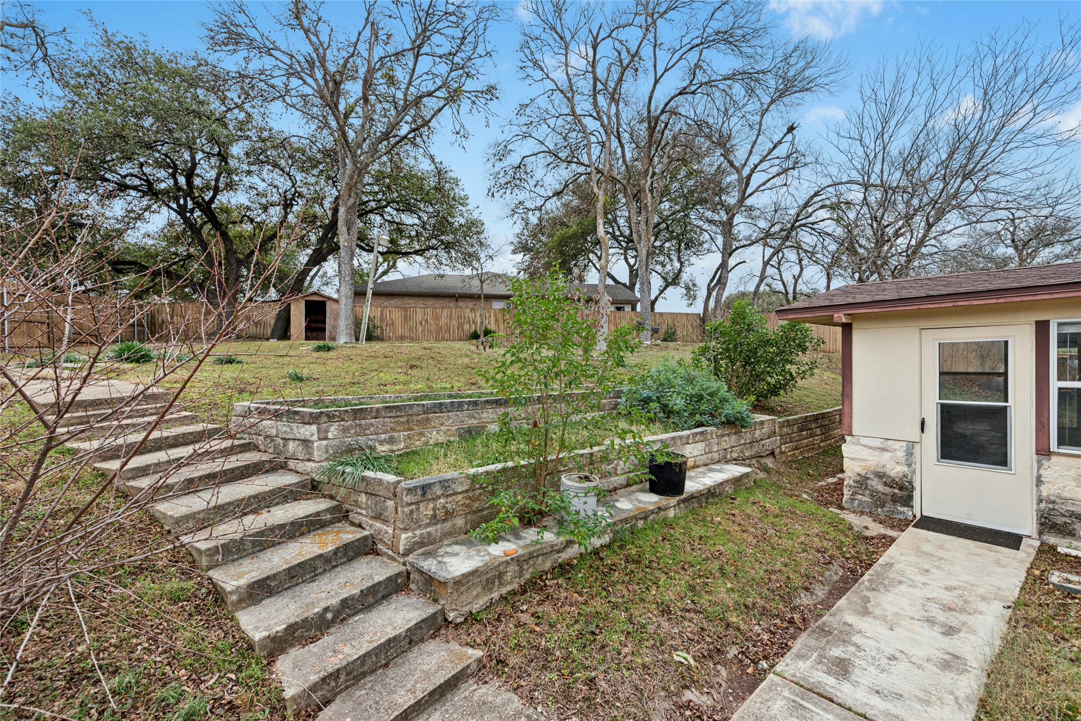 1444 Salem Meadow Circle Austin, TX 78745 - Photo 32 of 35 a view of a house with backyard and trees