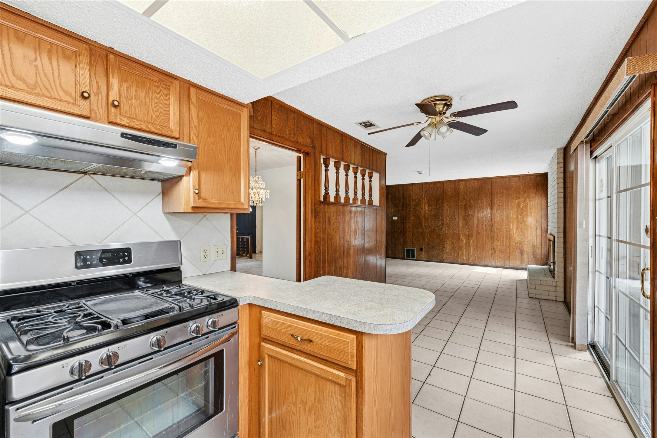 1444 Salem Meadow Circle Austin, TX 78745 - Photo 10 of 35 a kitchen with a stove and a refrigerator