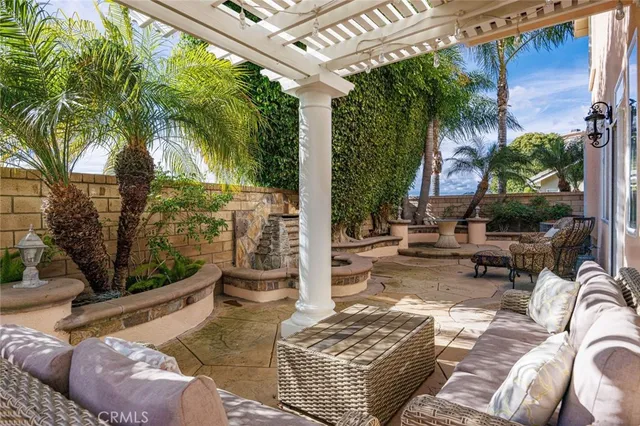 a swimming pool with outdoor seating yard and barbeque oven