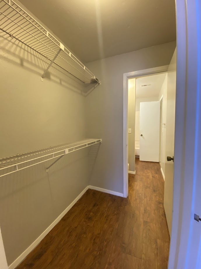 1305 West Villa Maria Road, Unit B104 Bryan, TX 77801 - Photo 12 of 14 a view of a room with wooden floor